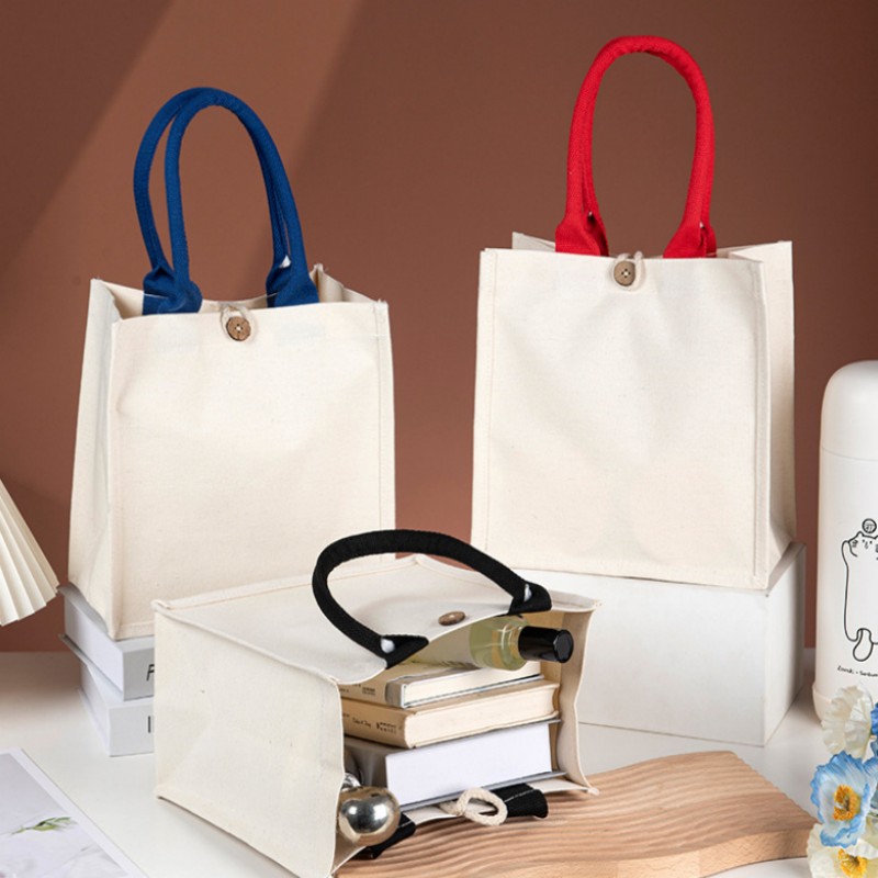 Borsa tote in tela con manico a contrasto e bottone in legno