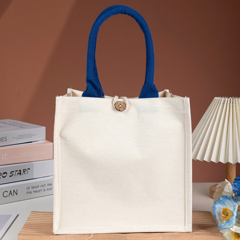 Borsa tote in tela con manico a contrasto e bottone in legno