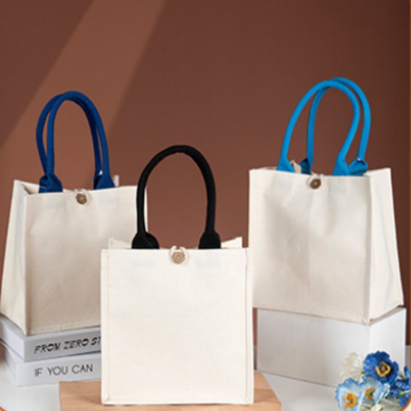 Borsa tote in tela con manico a contrasto e bottone in legno