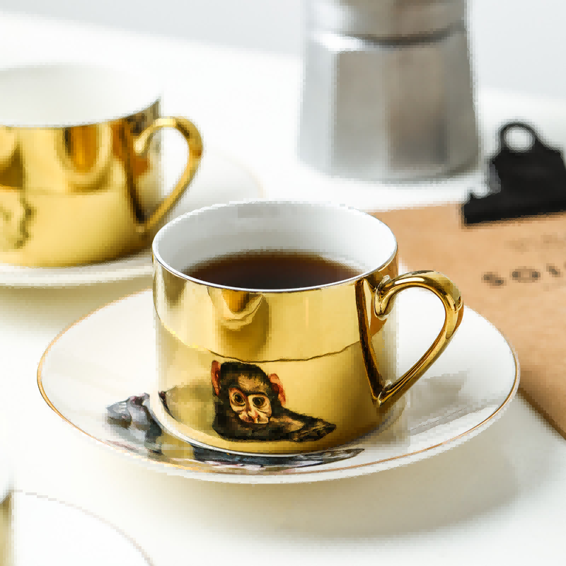 Set tazza e piattino in ceramica con riflesso a specchio