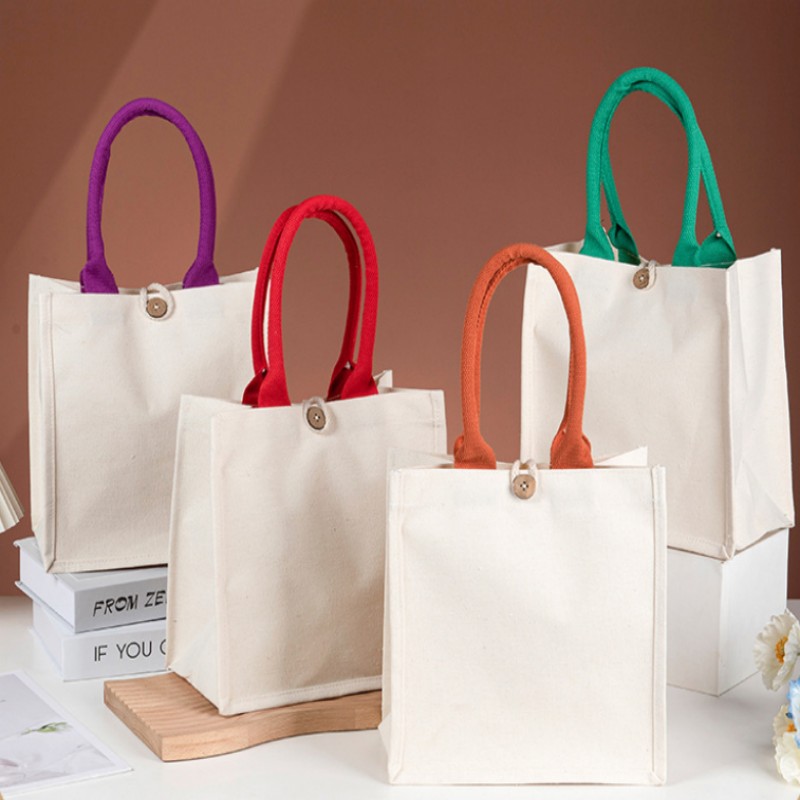 Borsa tote in tela con manico a contrasto e bottone in legno